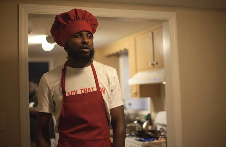 Paid In AmeriKKKa Returns, Chef Up Fish N’ Grits in “BAKKK N DA KITCHEN” Video